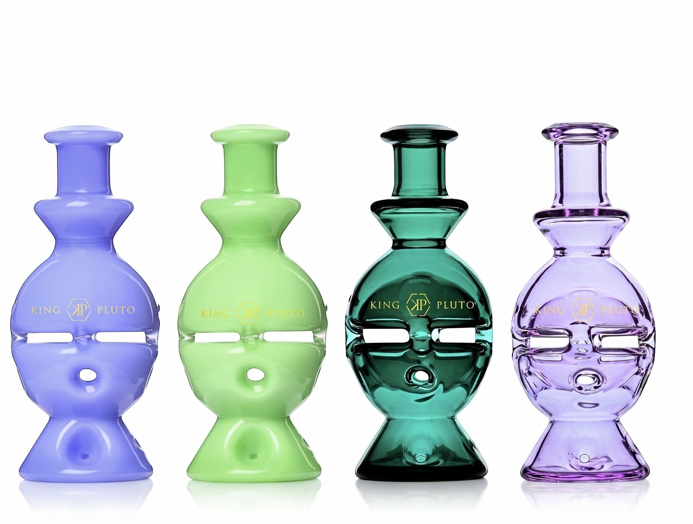 Four 6-inch King Pluto Fabb Egg glass handpipes in assorted translucent and opaque colors with gold branding.
