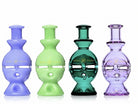 Four 6-inch King Pluto Fabb Egg glass handpipes in assorted translucent and opaque colors with gold branding.